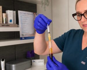 Marlena preparing platelet-rich plasma from a client blood sample at Dermesthetica Skin Clinic